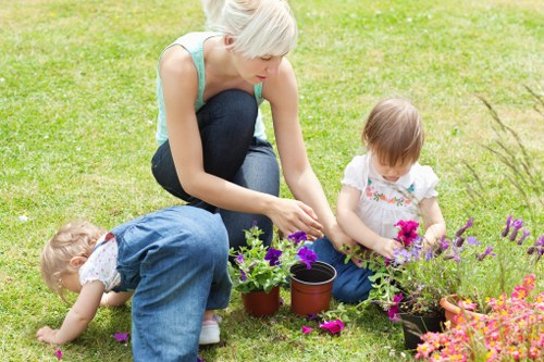 Professional gardener reviewing safe procedures before outdoor maintenance